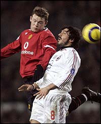 Wayne Rooney is challenged by Gennaro Gattuso