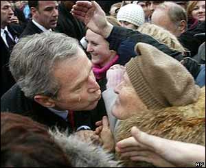 President Bush kisses a Slovak woman from the crowd