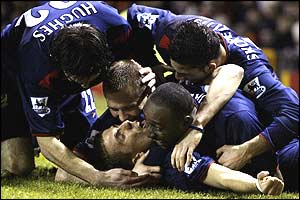 Gary O'Neil is congratulated by his Portsmouth team-mates