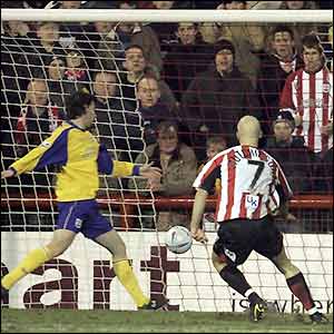 Southampton fail to clear and Eddie Hutchinson nets from close range