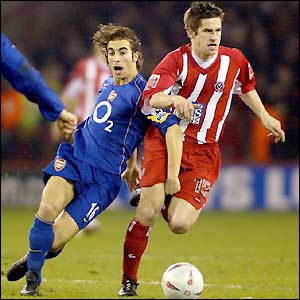 Paul Thirwell looks for a breakthrough against Arsenal