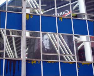 The face of Chelsea manager Jose Mourinho is reflected on a Cardiff building in the run-up to the Carling Cup final (Peter Morgan)