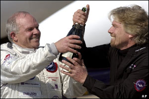 Fossett opens a bottle with Sir Richard Branson (AP)