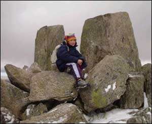 Gwenllian Deiniol, from Llanrwst, on the summit of Tryfan after climbing it for the first time with her father 