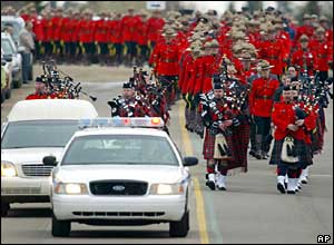 Pipers lead the funeral procession for Peter Schiemann
