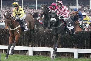 Runners and riders pass the main stand in the Irish Independent Arkle Challenge Trophy Steeplechase