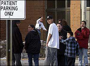Family and friends of victims wait at the local hospital
