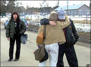 School superintendent comforts teacher