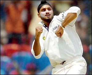 Harbhajan Singh celebrates a wicket as he finishes on 6-152