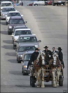 Daryl Lussier and Michelle Sigana's coffins are carried through Red Lake