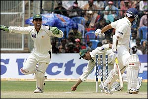 Shahid Afridi bowls India's Sourav Ganguly