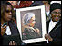 Picture of Rosa Parks being held by mourners 