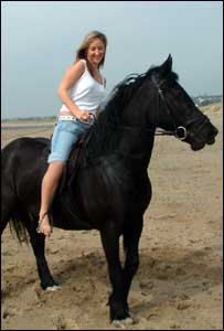 Sarah Hunt's daughter Sammi on her horse at the beach at Merthyr Mawr