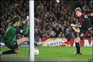 Bastian Schweinsteiger slots the ball past Petr Cech l