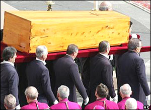 Pallbearers carry the coffin of Pope John Paul II