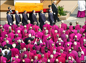 Pallbearers carry the coffin of Pope John Paul II