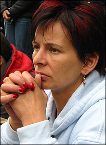 Mourner watches the funeral of Pope John Paul II