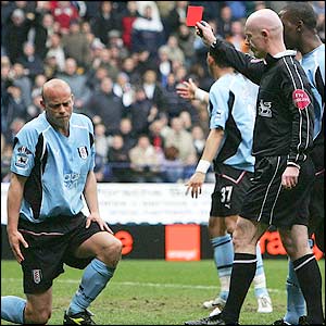 Fulham's Claus Jensen is sent off after just 11 minutes for a deliberate handball