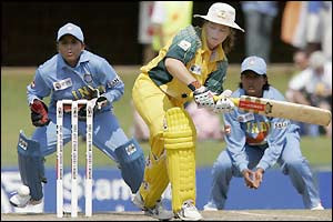 Karen Rolton fends off an Indian delivery