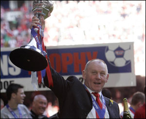 Wrexham manager Denis Smith with the trophy