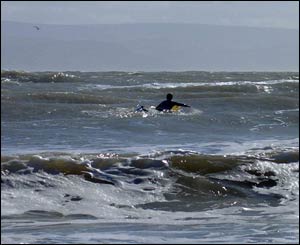 A surfer braves the waves at Llantwit Major beach (Allan Carty, from St Athan) 