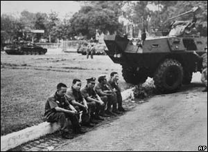 ARVN soldiers sit by the roadside