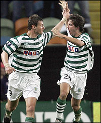 Marius Niculae of Sporting Lisbon is congratulated by team-mate Joao Moutinho