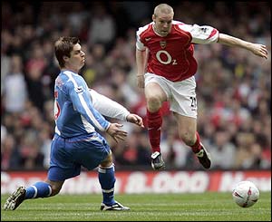 Blackburn's Garry Flitcroft challenges Arsenal's Philippe Senderos