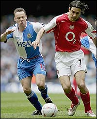 Robert Pires sprints clear of Blackburn's Paul Dickov
