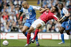 Steven Reid shrugs Arsenal's Gilberto aside