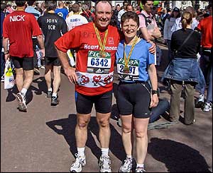 Peter Riley-Jordan and his wife Christine with their medals