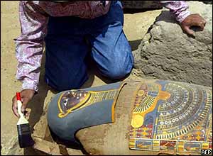 Archaeologist brushes dust off the mummy