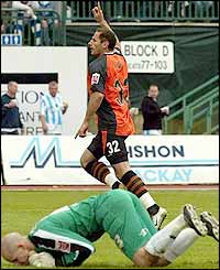 Ipswich striker Shefki Kuqi runs to the fans after putting his side ahead