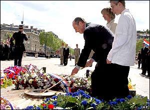 In Paris, President Jacques Chirac lit the flame at the Tomb of the Unknown Soldier under the Arc de Triomphe.