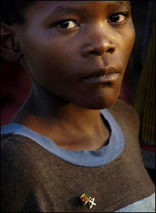 A boy wears his newly acquired Saltire/Malawi flag badge 