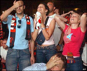 AC Milan fans show their disappointment at losing to Liverpool