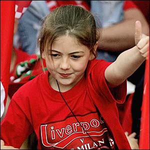 A girl sticks her thumb up at the Liverpool parade