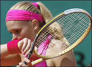 French tennis player Tatiana Golovin wipes her face during a match on Saturday