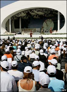 A crowd attends a mass celebrated by Benedict XVI