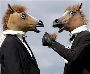 Two men with horse head masks arrive at Epsom