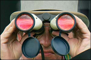 The racegoer uses a fancy pair of binoculars
