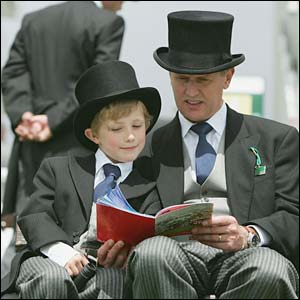 A father and son peruse the race card