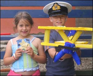 Joseff Lloyd Thomas and Elen Haf Thomas presenting models they have made (Brian Thomas)