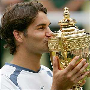 Roger Federer with the Wimbledon trophy 