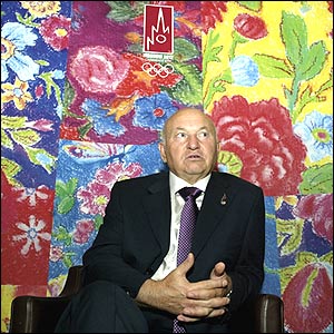Moscow Mayor Yuri Luzhkov answers reporters' questions during a press conference in Singapore 