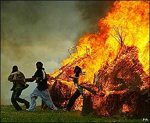 Demonstrators set huts on fire