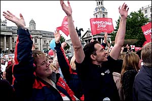 Fans celebrate on hearing that London is in the final two to host the 2012 Olympic Games