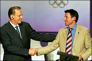 IOC president Jacques Rogge hands Lord Coe the host city contract