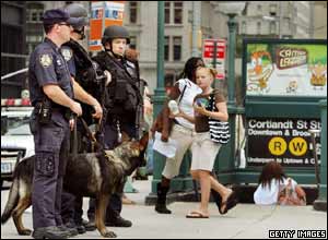 New York City Police Department Emergency Service Unit officers keep watch in front of the Cortlandt Street subway station at the World Trade Center site 