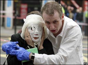 An injured Tube passenger is escorted away from Edgware Road station